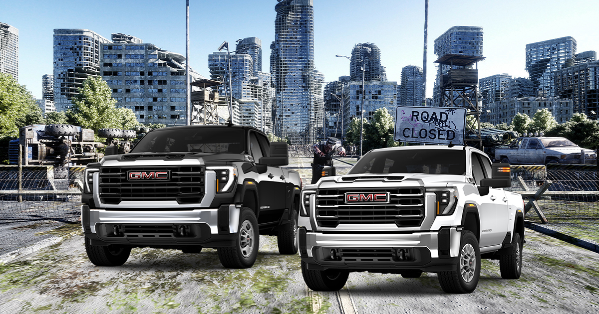 A black and white GMC Sierra 2500 and 3500 HD pickup truck in the city.