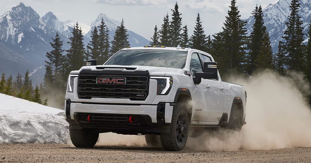 A GMC truck driving on snowy terrain