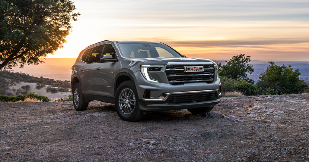 A 2026 GMC Acadia on a mountain setting